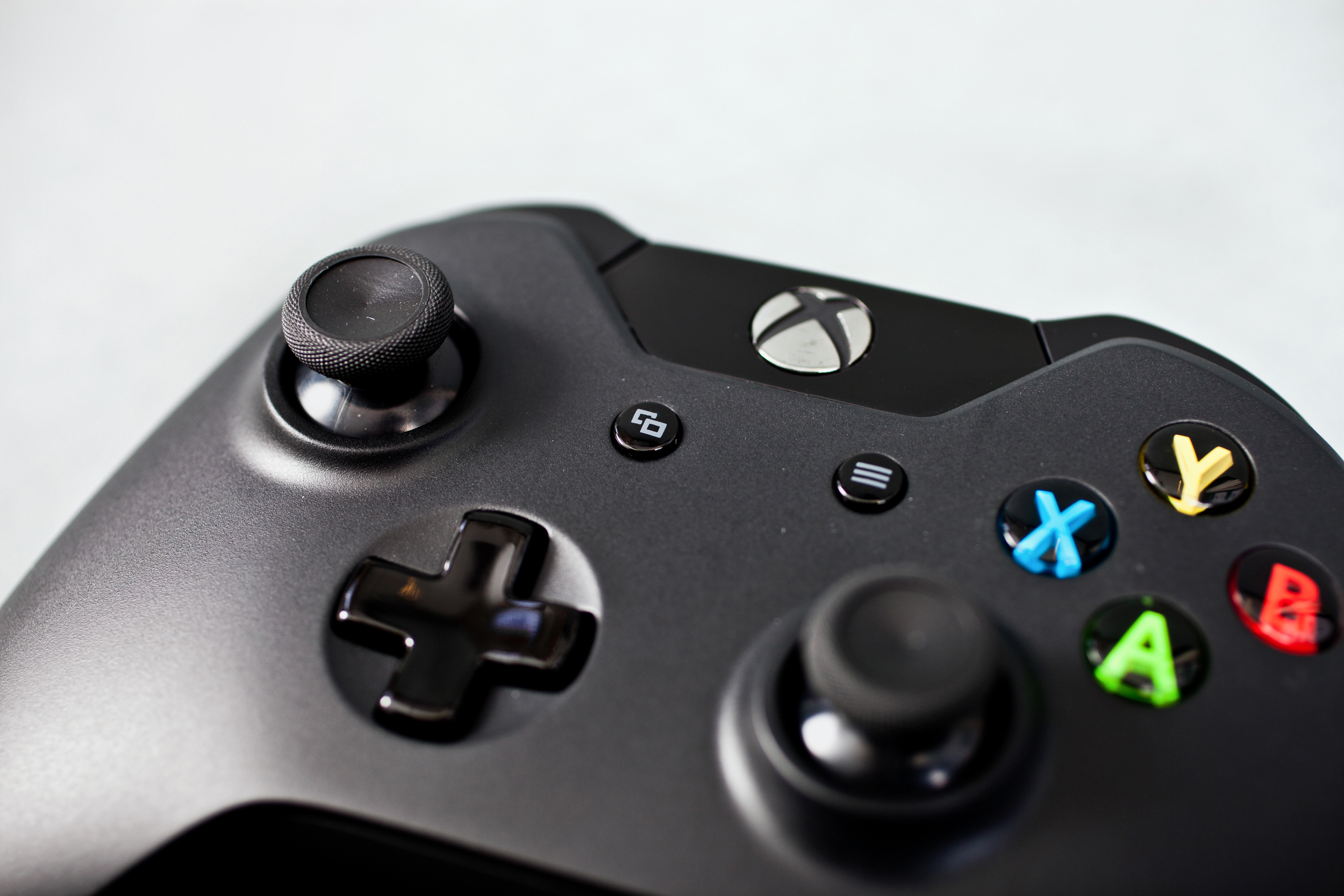 <p>The new controller has a laundry list of incremental improvements, from a more precise cross-shaped D-pad to knurled thumbstick rims for better grip.